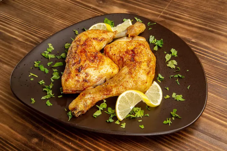side-close-up-view-chicken-herbs-plate-chicken-legs-with-lemon-herbs