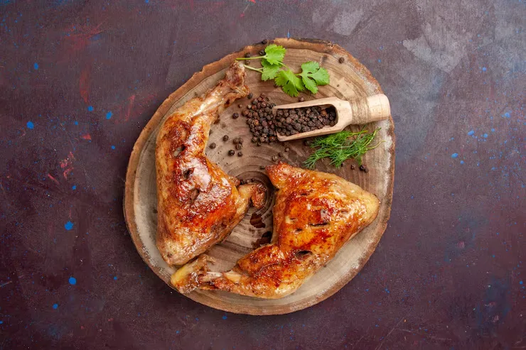 top-view-delicious-fried-chicken-with-pepper-dark-space